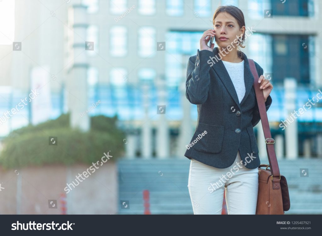 stock-photo-business-woman-talking-on-phone-outside-1205407921