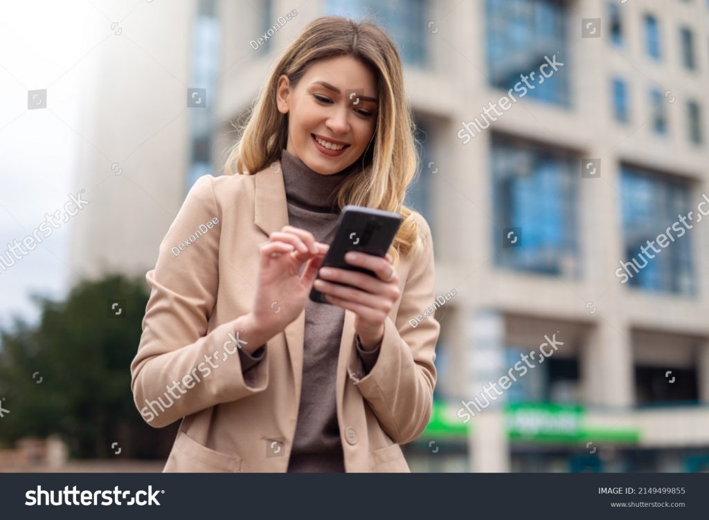 stock-photo-business-woman-using-phone-to-send-message-2149499855