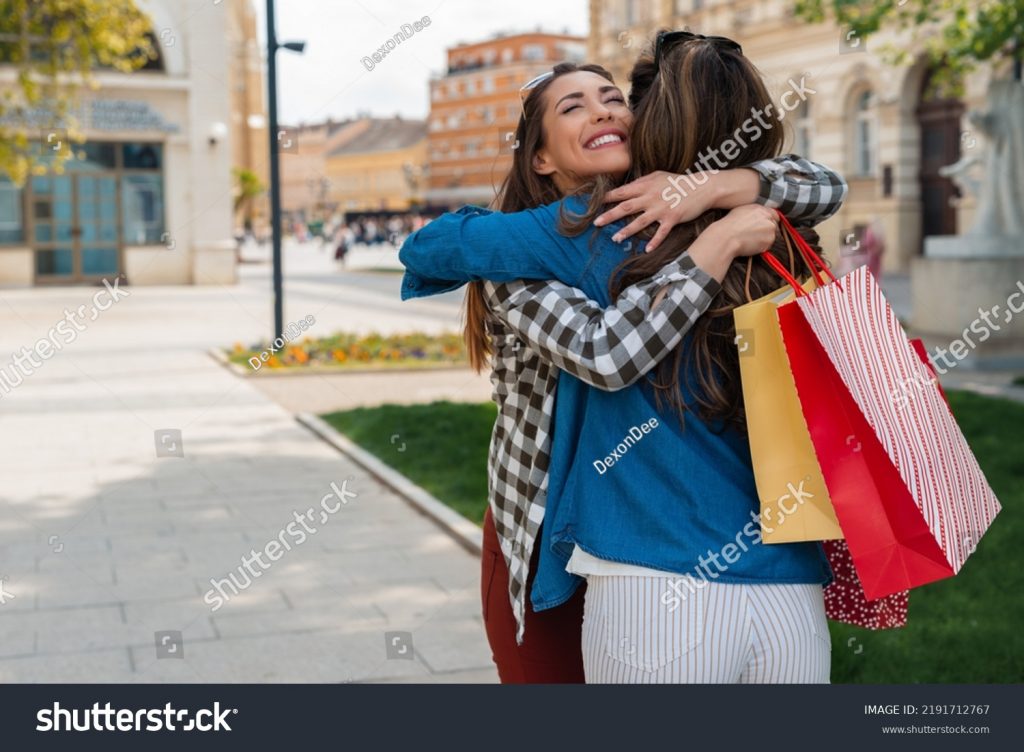 stock-photo-two-bestfriends-hugging-each-other-on-city-street-2191712767