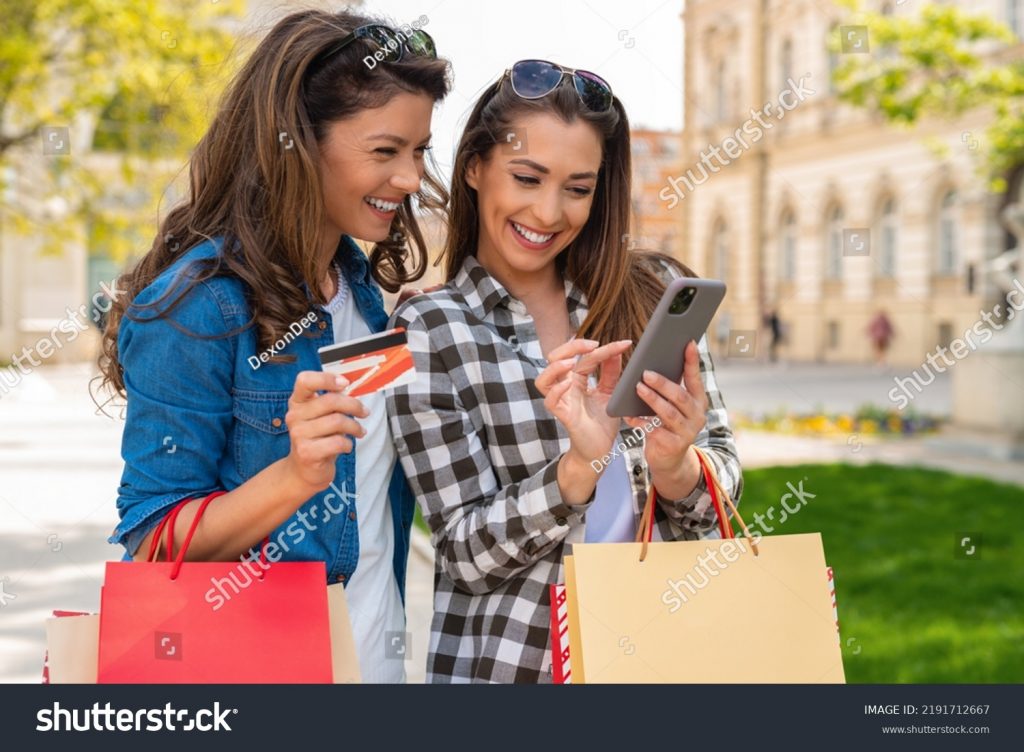 stock-photo-woman-using-credit-card-and-mobile-phone-for-shopping-2191712667